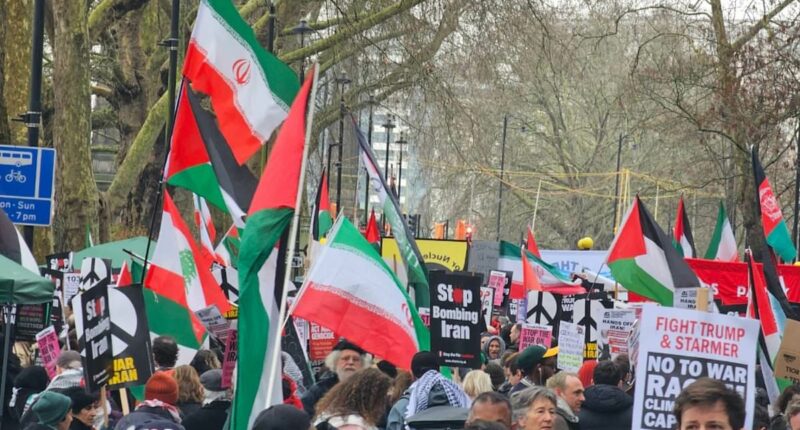 Leftist demonstrators chant 'victory to Iran' at march through London