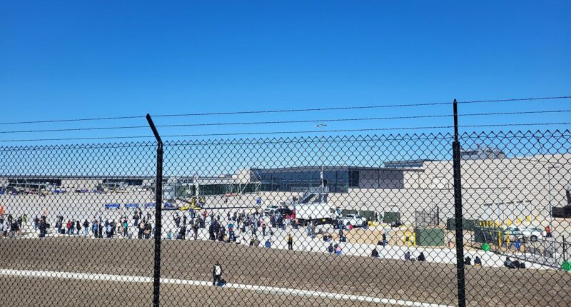 Major Midwest airport is evacuated as passengers flee on to tarmac