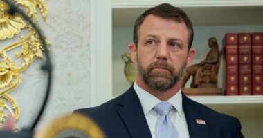 Markwayne Mullin's face says it all as Trump admits he 'didn't know' he's Native American at DHS swearing-in
