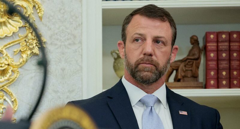 Markwayne Mullin's face says it all as Trump admits he 'didn't know' he's Native American at DHS swearing-in