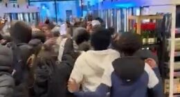 Mob of youths run riot in M&S store as police watch on powerless