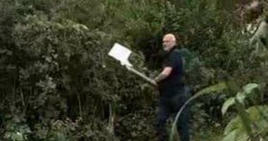 Moment high-flying HSBC executive hacks down a CCTV camera with an axe