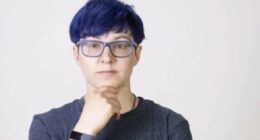 Non-binary activist wins compensation after taking year-and-a-half off work with stress because hair salon's online booking form only offered male or female cuts