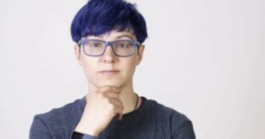 Non-binary activist wins compensation after taking year-and-a-half off work with stress because hair salon's online booking form only offered male or female cuts