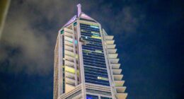 One man killed and two skyscrapers in flames hours after airport hit