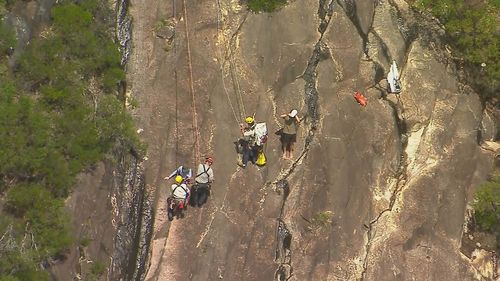 Oï»¿ne teenager is dead and another is fighting for life after the pair fell while hiking in the Glasshouse Mountains on Queensland's Sunshine Coast.