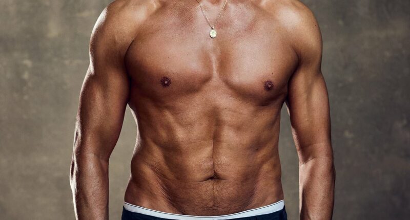 Paddy McGuinness, 52, shows off his  six-pack and bulging biceps