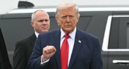 President Donald Trump salutes coffins of six fallen soldiers killed