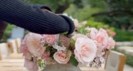 Prince Harry praises Meghan Markle's flower arranging in new family videos showing a glimpse of Lilibet's flowing red hair