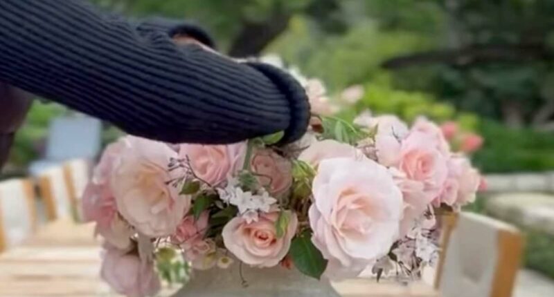 Prince Harry praises Meghan Markle's flower arranging in new family videos showing a glimpse of Lilibet's flowing red hair