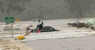 Rescues and road closures as flooding rain moves across Queensland