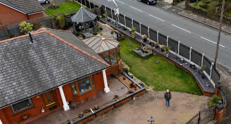 Retired couple forced to tear down £4,500 seven-foot tall fence
