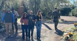 Savannah Guthrie lays flowers outside missing mother Nancy's home