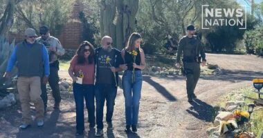 Savannah Guthrie lays flowers outside missing mother Nancy's home