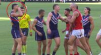 See the ugly moment footy star goes too far with 'crybaby' sledge as he tries to bring back awful family memory for rival