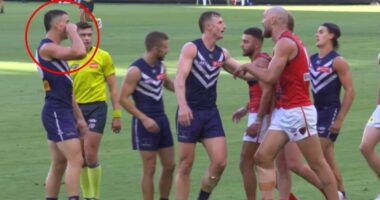 See the ugly moment footy star goes too far with 'crybaby' sledge as he tries to bring back awful family memory for rival