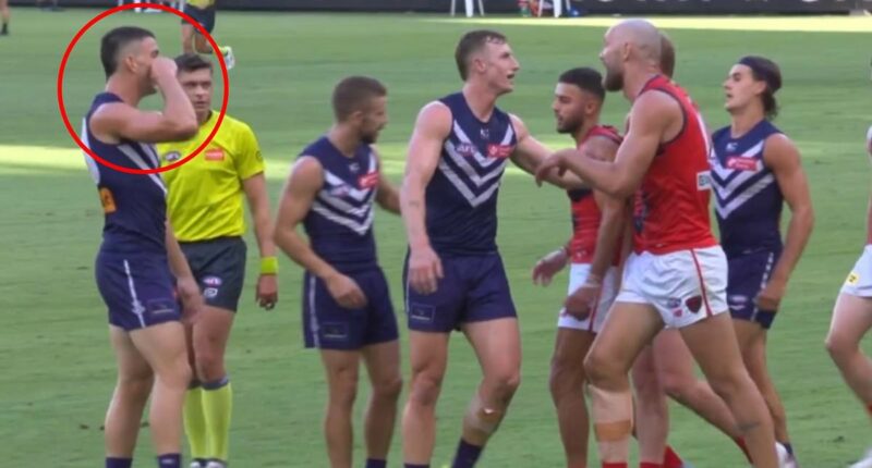 See the ugly moment footy star goes too far with 'crybaby' sledge as he tries to bring back awful family memory for rival