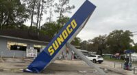 Severe storms topple gas station awning amid heavy rain and wind
