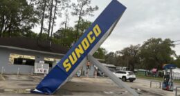 Severe storms topple gas station awning amid heavy rain and wind