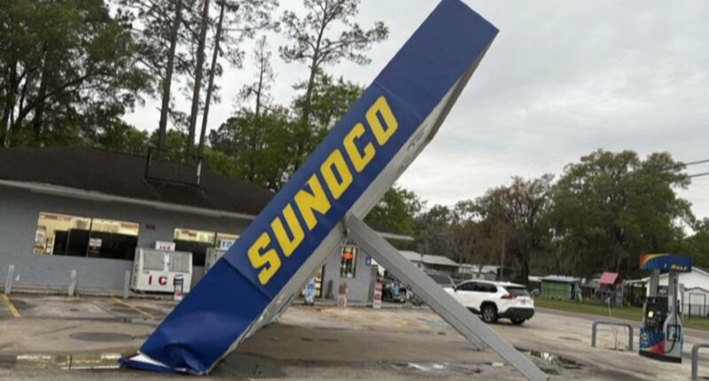 Severe storms topple gas station awning amid heavy rain and wind