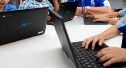 Sacred Heart Primary School, at Mount Druitt. Principal Glenn Patchell, with yr 3& 5 students who did the NAPLAN test online