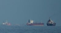 Oil tankers and cargo ships line up in the Strait of Hormuz as seen from Mina Al Fajer, United Arab Emirates, Wednesday, March 11, 2026. (AP Photo/Altaf Qadri)
