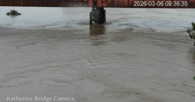 Town facing flood disaster as twin tropical lows dump rain