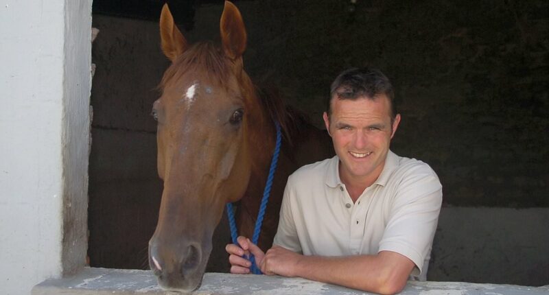 Trainer who 'attacked dogwalker with hockey stick' says he fell over