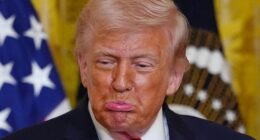 President Donald Trump reacts after Olympic bobsledder Kaillie Humphries presented him with the Order of Ikkos medal at a women's history month event in the East Room at the White House, Thursday, March 12, 2026, in Washington.