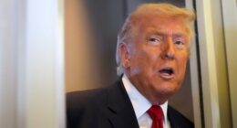 President Donald Trump speaks to reporters while traveling aboard Air Force One