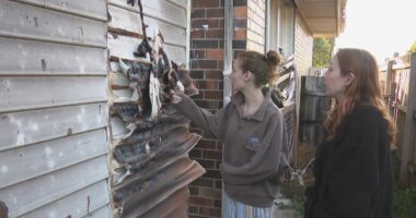 Two men arrested over woman's death in unit complex fire