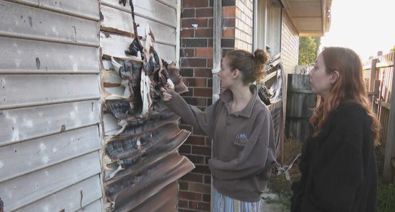 Two men arrested over woman's death in unit complex fire