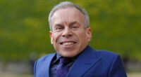 Warwick Davis' is pictured with mystery girlfriend of a year, 'Sponge'