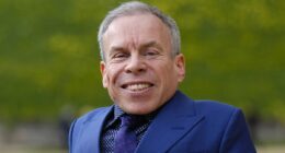 Warwick Davis' is pictured with mystery girlfriend of a year, 'Sponge'