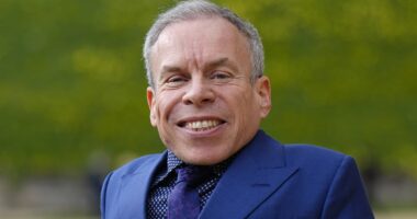 Warwick Davis' is pictured with mystery girlfriend of a year, 'Sponge'