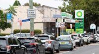 Cars lining up outside a petrol station in Mascot, Sydney.