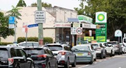 Cars lining up outside a petrol station in Mascot, Sydney.