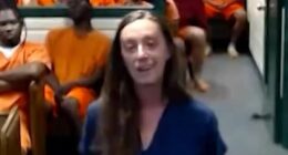 Woman smirks in court as she is accused of fatally striking boy, 8