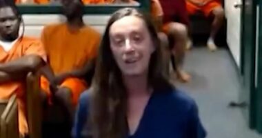 Woman smirks in court as she is accused of fatally striking boy, 8