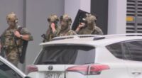 Heavily-armed police in camoflage gear attended the scene.
