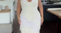 A plus-size model has left her fans divided after she unveiled the white gown she wore for her wedding welcome party