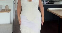 A plus-size model has left her fans divided after she unveiled the white gown she wore for her wedding welcome party