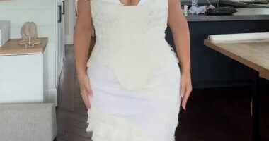 A plus-size model has left her fans divided after she unveiled the white gown she wore for her wedding welcome party
