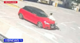 Car swerves along road, trying to shake off woman clinging onto bonnet