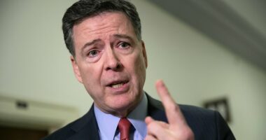 Comey surrenders to police after being accused of threat against Trump