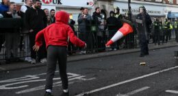 Cone thrown at police and roads blocked in Epsom