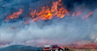 Crews work to contain southern California wildfire as mandatory evacuations remain