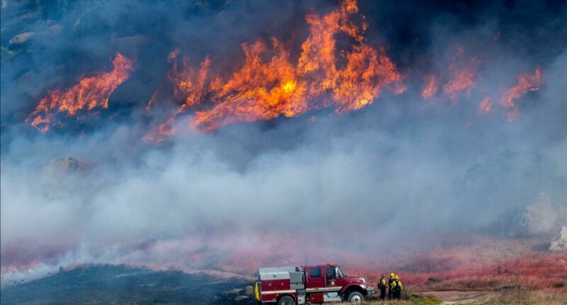 Crews work to contain southern California wildfire as mandatory evacuations remain