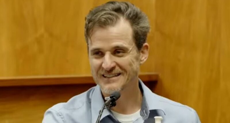 Doctor who tried to push wife off Hawaii cliff LAUGHS at his trial