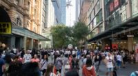 people walking on the busy Pitt Street retail area in Sydney during the boxing day sales